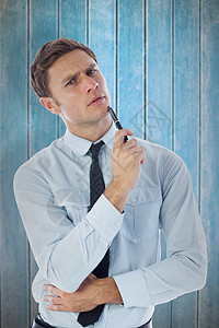 商业商持笔思想的复合图象数字领带商务木头男性公司职业男人棕色下巴图片