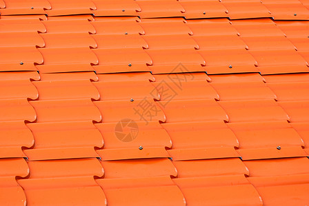 Dusty 橙色金属板屋顶背景/纹理图片