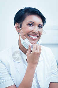 自信的女牙医微笑黑发女士工作牙科混血保健实验女性医疗短发图片