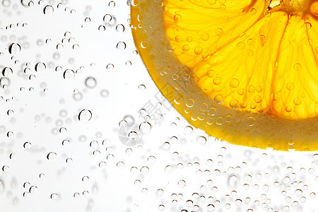 水中的橙子苏打气泡白色液体柠檬宏观饮料水果气体图片