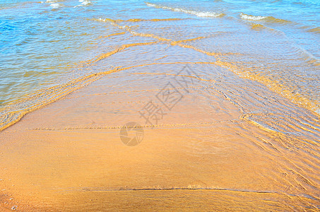 桑迪海滩晴天海滨季节海浪海岸沿海流动波纹海洋阳光图片