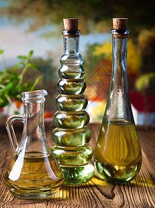 瓶装橄榄油 地中海农村主题处女液体烹饪食物蔬菜油壶宏观草药营养叶子图片