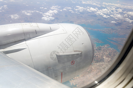 空中飞机窗口 有天空和云彩的风景气氛土地窗户假期天气旅游臭氧车辆运输蓝色图片