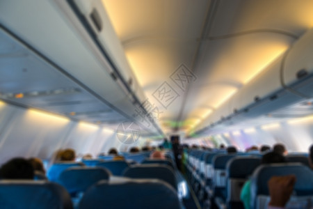 内空飞机的模糊背景情况经济力量椅子旅行男人商业技术座位窗户车辆背景图片