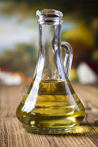 外维尔京利橄榄油 地中海农村主题瓶子叶子食物玻璃香蒜烹饪液体香料美食蔬菜图片