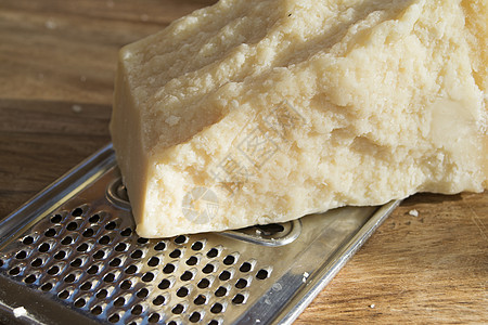 将干酪加压至 grate黄色小吃产品美食牛奶磨碎奶制品食物白色图片