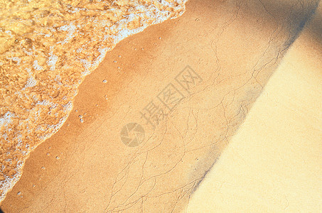 沙沙滩上的柔软波浪海洋海岸海岸线环境波纹太阳反射蓝色流动晴天图片