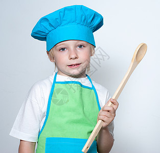 做厨师的孩子面包师快乐勺子幸福食物烹饪围裙帽子思考微笑图片