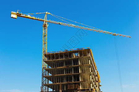 建筑起重机的建造天空工作建筑学技术蓝色构造财产城市房子商业图片