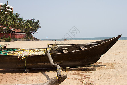 印度果阿岛印度沙滩上的老鱼船旅行海景海洋海岸异国热带海滩场景海浪太阳图片