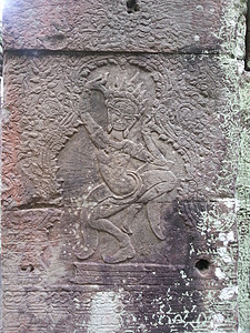 Apsara 舞蹈雕塑岩石石头雕刻飞天寺庙背景图片