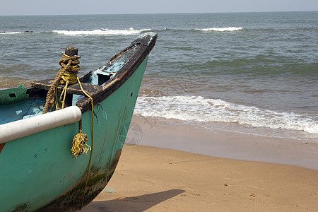 印度果阿岛印度沙滩上的老鱼船热带支撑海岸海洋海滩地平线海岸线旅行海浪异国图片
