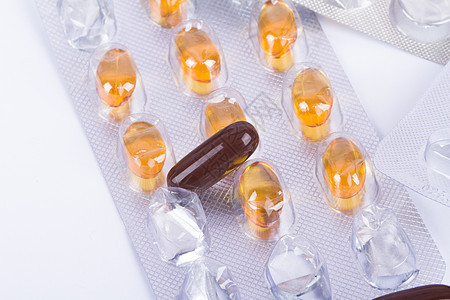 药丸 Blister条形中的维他命棕色黄色卫生胶囊药片吸塑条化工药品化学保健背景图片