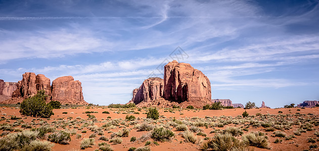 蓝色天空下的古迹谷景观公园天空旅行沙漠砂岩石头红色风景地平线图片