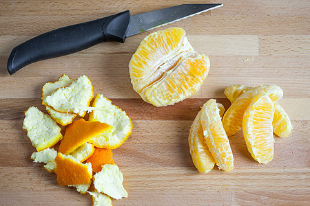 切橙色海军热带皮肤片段砧板圆形橘子食物背景图片