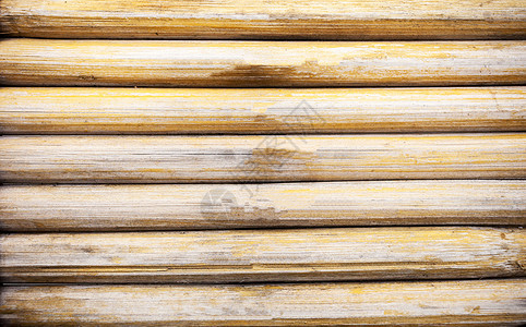 hunge 黄色竹子背景和纹理棕色热带栅栏树枝森林花园文化绑定褪色枝条背景图片