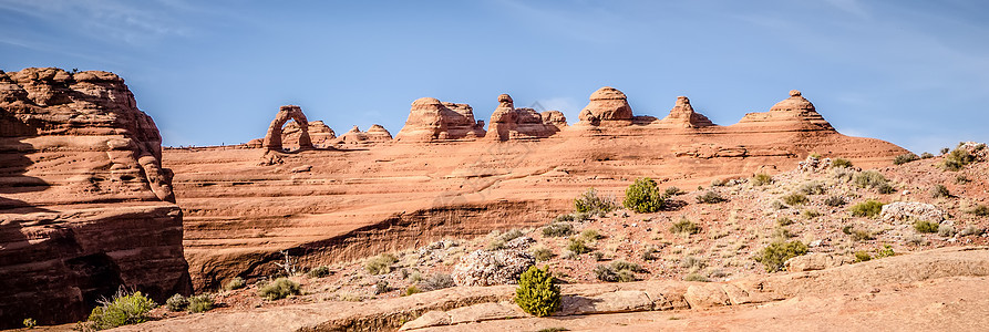 靠近精密拱门的国家公园石头日落峡谷爬坡岩石沙漠天空旅游蓝色砂岩图片