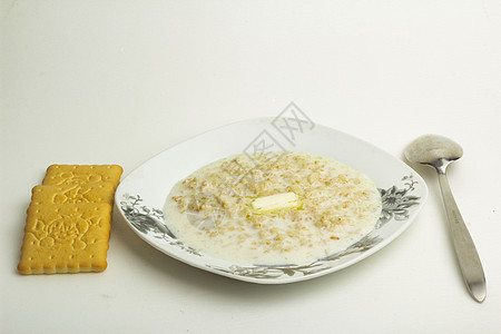 碗里煮粥美食黄油早餐营养勺子饼干产品燕麦盘子稀饭图片