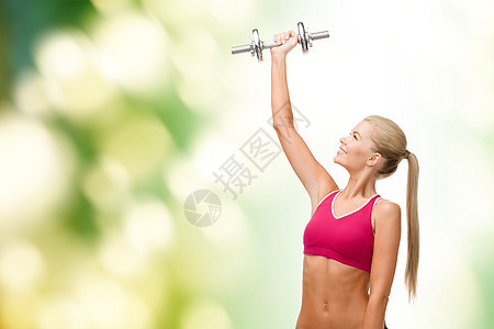 带着重钢的哑巴微笑的女人健身房运动装重量光盘女孩运动员损失肌肉减肥数字图片