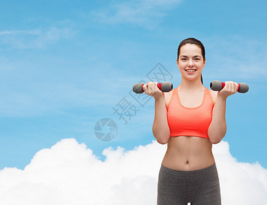年轻运动女青年 有轻聋哑铃运动员运动装健身房耐力身体训练饮食重量肌肉损失图片
