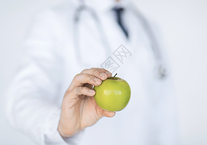 具有绿苹果的男男性医生药品重量水果生物减肥损失饮食长袍食欲纤维素图片