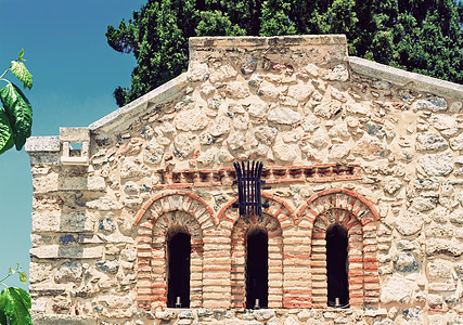 希腊克里特教堂外墙的碎片历史大教堂绿色天空蓝色国家宗教旅行文化建筑学图片