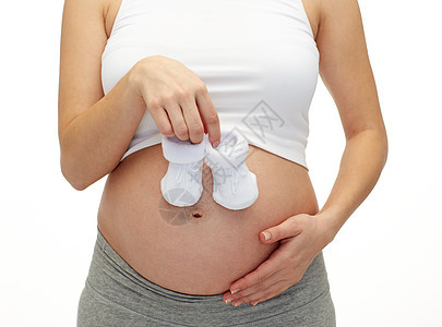 怀孕孕妇与育婴婴儿紧闭母性孩子女士分娩靴子女性家庭生育力腹部父母图片