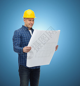 戴有蓝图的头盔的男性微笑建筑者安全帽建筑师承包商蓝色工匠修理工草图建造建设者男人图片