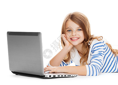 带着笔记本电脑说谎的笑着微笑的学生女孩小学生网络视频青春期幼儿园孩子家庭作业童年青少年学习图片