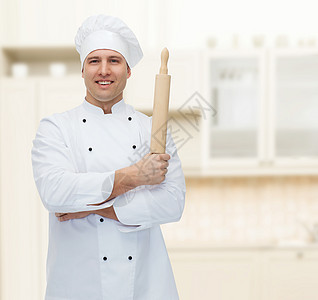 快乐的男厨师拿着滚针做饭面包师职业男人炊具白色餐厅烹饪职员别针美食图片