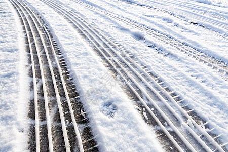 积雪中的车胎轨迹痕迹汽车车辆车轮天气曲目交通轮子打印自行车图片