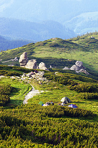 靠近山峰的营地冰川岩石绿色帐篷日出旅游水平地标露营顶峰图片