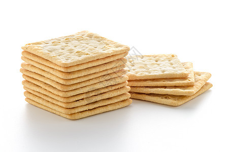 Cracker 裂开器正方形宏观棕色白色黄色小吃盐渍小麦饼干面包图片