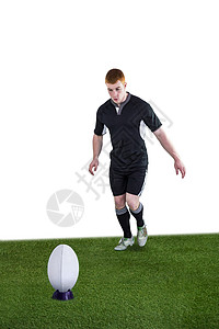 橄榄球运动员踢一脚运动球衣竞赛男人体育运动服男性专注竞技分数图片