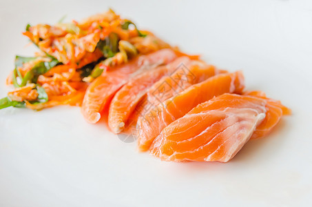沙门生鱼熏制用餐寿司海鲜牛扒鱼片盘子橙子白色红色图片
