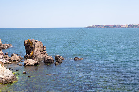 海景海浪绿色石头天空棕色海滨岩石水平黄色蓝色图片