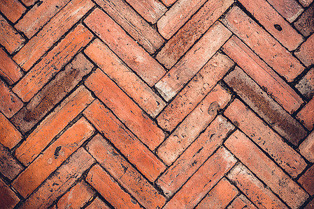 旧石砖墙的背景红色棕色建筑学地面建筑材料水泥古董石头图片