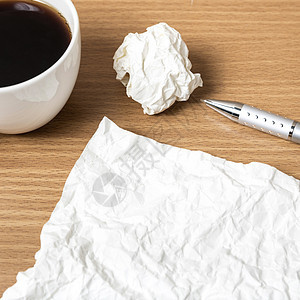 纸上加铅笔和咖啡杯杯子撰稿人软垫工作记事本商业作家咖啡办公室桌子图片