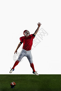 美国足球运动员 试图捕捉橄榄球比赛运动服跳跃足球场面漆草坪草皮红色头盔竞技活动图片