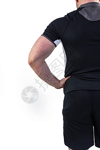 手放在臀部的橄榄球运动员运动运动服肌肉播放器黑色男性男人体育竞技竞赛背景图片