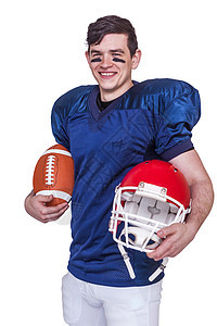 拿着球和盔甲的美国橄榄球运动员运动足球面漆头盔四分卫运动服男性蓝色战绘竞赛图片
