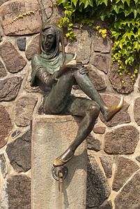 传奇人物德国Mlln的喷泉雕塑迷信童话小丑丑角幸福骗局塑料吸引力细绳背景