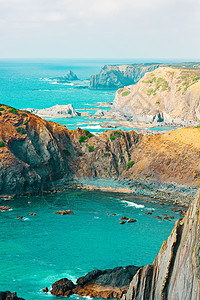 大西洋悬崖地平线植物泡沫阴霾渔夫波浪海洋岩石季节图片