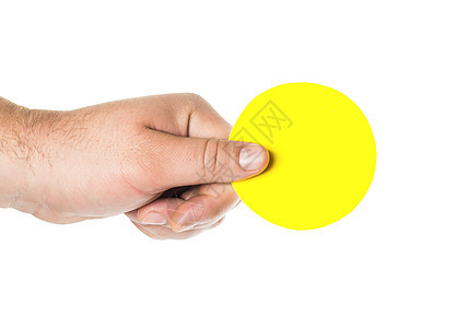 男人的手握着圆黄色药片背景图片