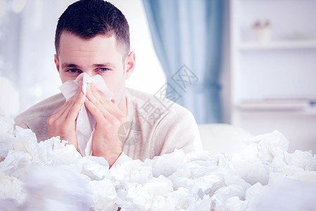 年轻人打鼻涕的复合图像男性手帕卫生流感长椅鼻子保健衬衫疾病喷嚏图片