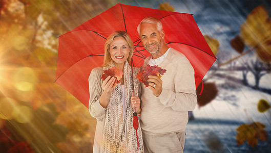 红伞下幸福情侣肖像的合成图象白色男人丈夫叶子树叶红色女性风景夫妻妻子图片