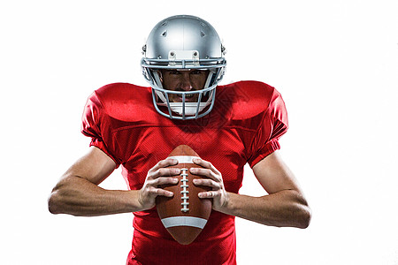 穿红色球衣和戴头盔的美国足球运动员服装专注四分卫竞赛头饰运动服体育运动男性团队图片