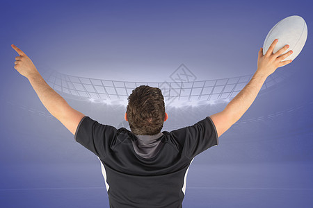 反向旋转橄榄球玩家的复合图像 观看胜利一只手球衣聚光灯运动计算机体育男性手势体育场播放器图片