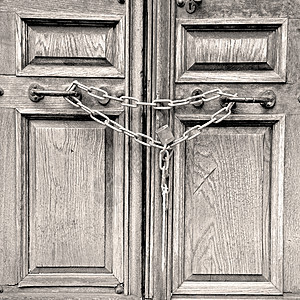 在英国的旧龙东门 紧紧锁着乡村青铜装饰品金属安全建筑门把手木头入口金子图片