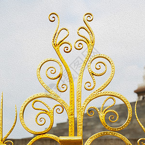 英国伦敦古董楼层和背景的抽象金色建造金属外壳腐蚀金子障碍材料墙纸排列栅栏图片